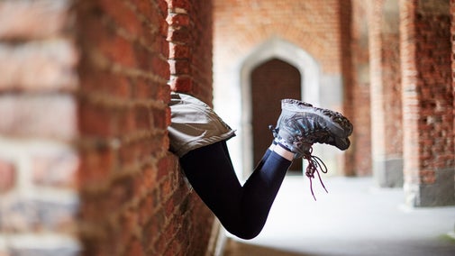 Children's feet sticking out from a window in the medieval tower at Tattershall Castle, Lincolnshire